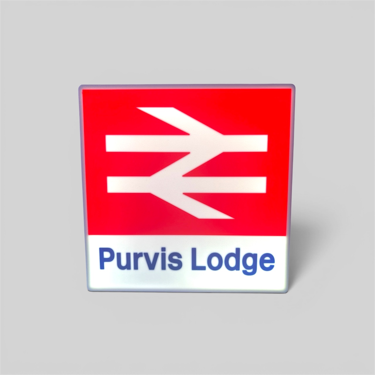 Multiple British Rail totem signs displayed together showing different station names