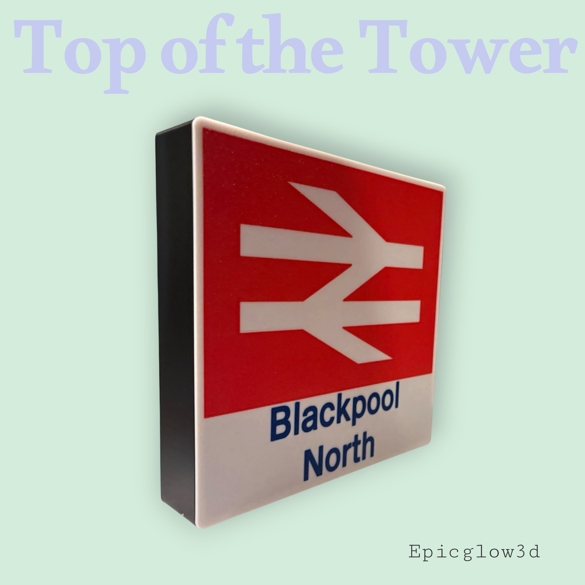British Rail totem station sign free-standing on desk in dark room